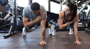 Toning Bingo Wings: Your Ultimate Guide to Sculpting Sleek Arms at the Gym 3 Fitness trainer demonstrating arm toning exercises Solihull