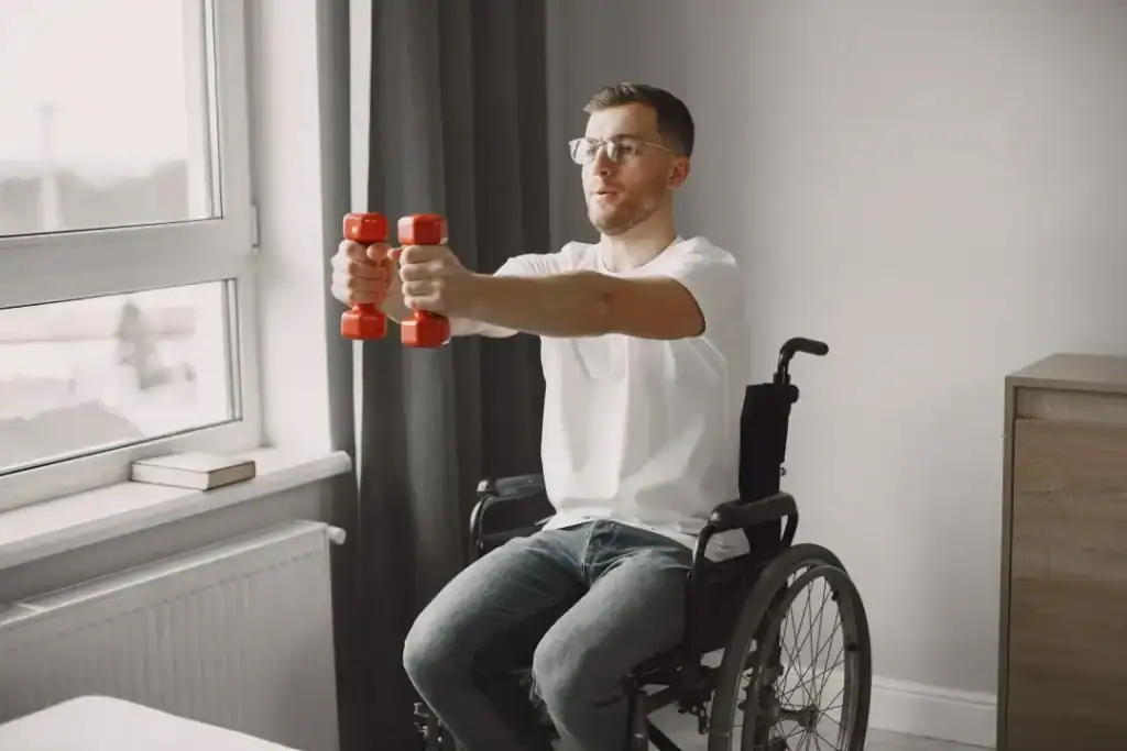 Image of man doing exercise in his wheelchair to aid weight loss Solihull