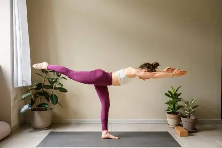 Achieving the Perfect Tone: How Often Should You Exercise for Results? 1 Woman doing Yoga exercise Solihull to help with toning the body.