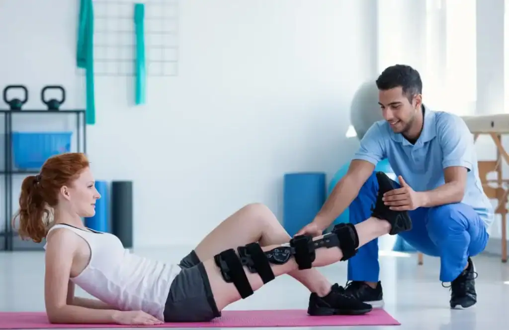 Debunking Meal Timing Myths: The Truth About Muscle Recovery 1 Woman having treatment to help muscle recovery Solihull after an injury